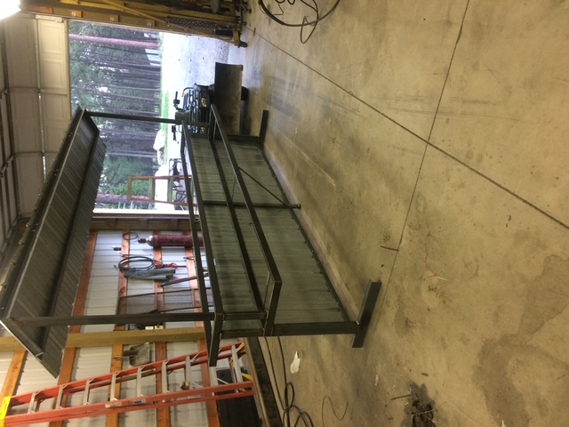 Raw steel bar frame laid flat in shop