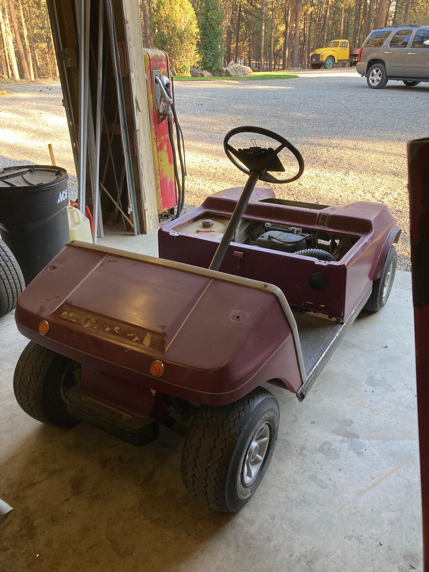 Golf cart before rebuild — worn original body and wheels