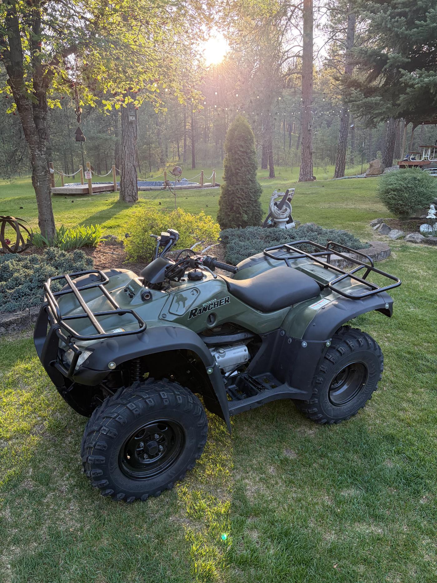 Restored Honda Rancher ATV front view at golden hour